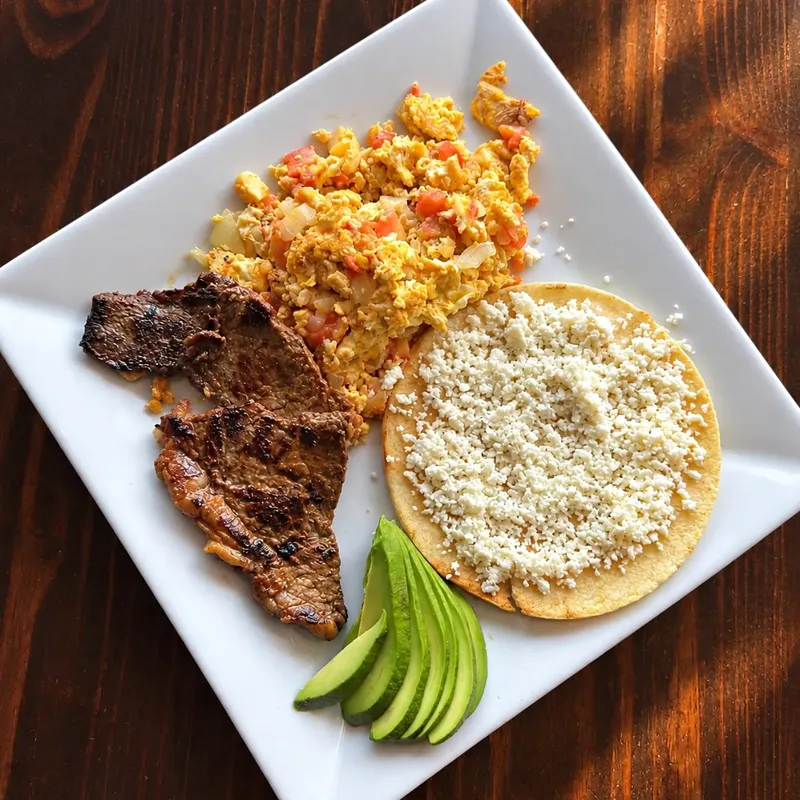 Tostadas with steak, eggs and avocado