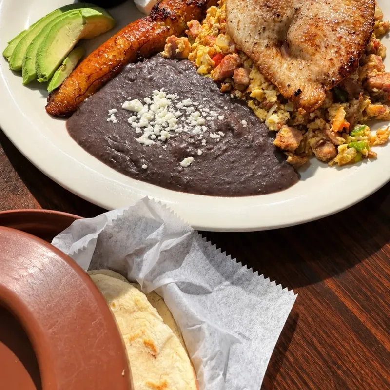 Breakfast plate with sweet plantains, black beans and avocado